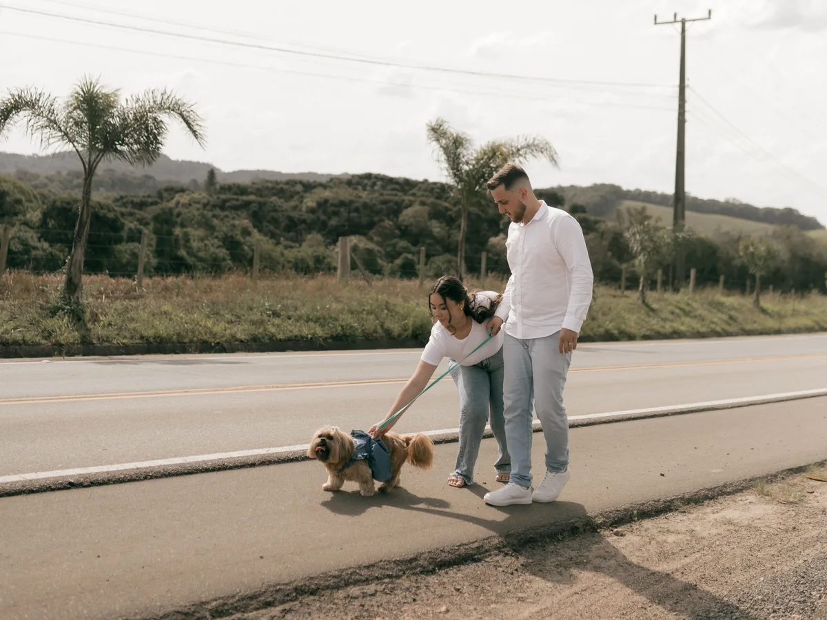 A couple spending time outdoors with their dog