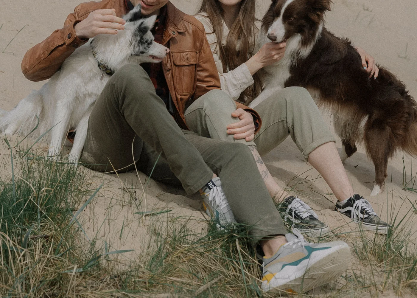 A couple and their dogs enjoying time outdoors